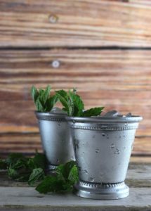mint julep cocktails cups with crushed ice and fresh mint