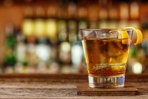 bourbon cocktail on wooden bar on the Kentucky Bourbon Trail